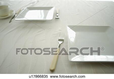 Plates and silverware on table, close up View Large Photo Image Stock Photography - Plates and silverware on table, close up. Fotosearch