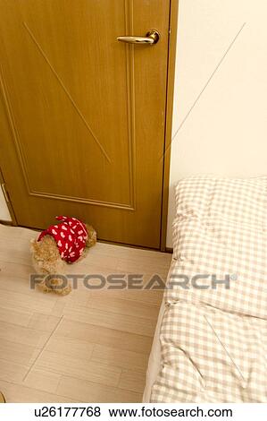 Stock Photo - Poodle by door. Fotosearch