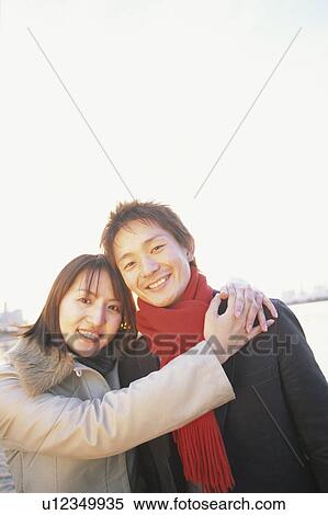 Portrait of young couple, smiling View Large Photo Image Stock Photography - Portrait of young couple, smiling. Fotosearch