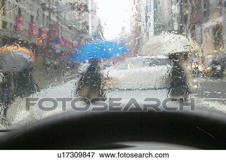 Rain Drops on Windshield, People Walking on Cross Over Point View Large Photo Image Stock Photo - Rain Drops on Windshield, People Walking on Cross Over Point. Fotosearch