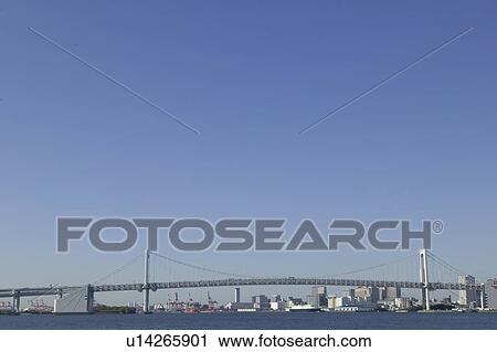 Stock Image - Rainbow Bridge and Tokyo Bay, copy space, Tokyo prefecture, Japan. Fotosearch