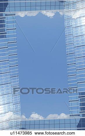 Stock Photography - Reflection of Sky on Building Window. Fotosearch
