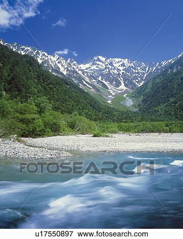 Stock Photo - River and mountain ranges, long exposure, Matsumoto city, Nagano prefecture, Japan. Fotosearch