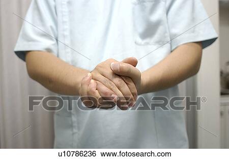 Shiatsu masseuse with his hands clasped View Large Photo Image Stock Photograph - Shiatsu masseuse with his hands clasped. Fotosearch
