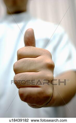 Shiatsu masseuse with his thumb up View Large Photo Image Stock Image - Shiatsu masseuse with his thumb up. Fotosearch