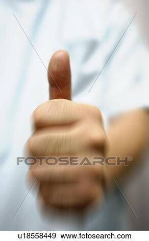 Shiatsu masseuse with his thumb up View Large Photo Image Stock Photo - Shiatsu masseuse with his thumb up. Fotosearch