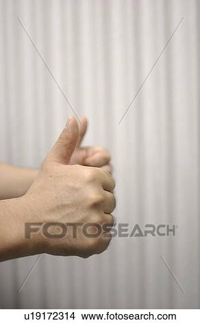 Shiatsu masseuse with his thumbs up View Large Photo Image Picture - Shiatsu masseuse with his thumbs up. Fotosearch