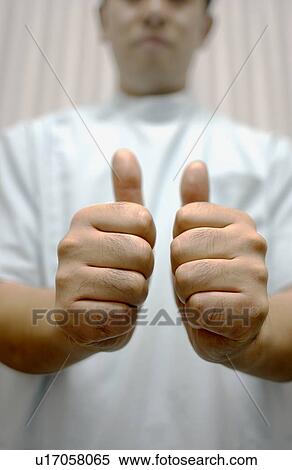 Shiatsu masseuse with his thumbs up View Large Photo Image Stock Photography - Shiatsu masseuse with his thumbs up. Fotosearch