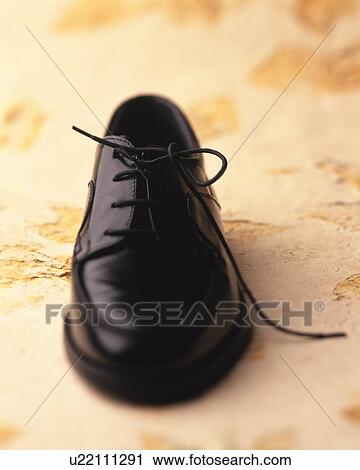 Stock Image - Shoe on floor. Fotosearch