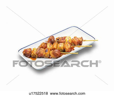 Skewered grilled chickens on plate, white background View Large Photo Image Stock Photo - Skewered grilled chickens on plate, white background. Fotosearch