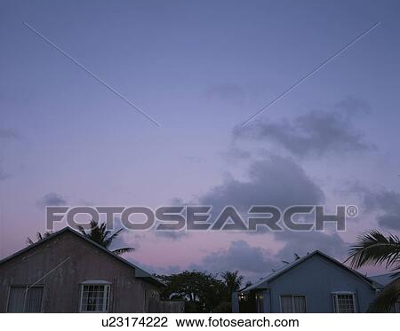 Stock Image - Sky and houses at dawn. Fotosearch