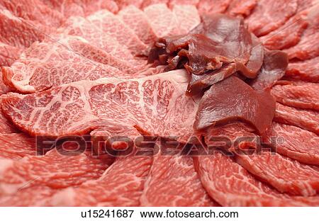 Stock Photo - Sliced raw meat, close up. Fotosearch