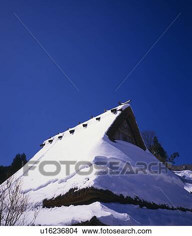 Picture - Snow on Thatched Roof. Fotosearch