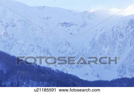 Snowcapped mountain peak View Large Photo Image Stock Image - Snowcapped mountain peak . Fotosearch