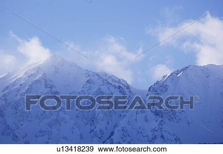 Snowcapped mountain peak View Large Photo Image Stock Photo - Snowcapped mountain peak . Fotosearch