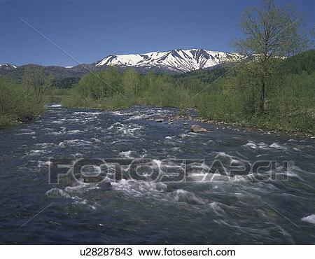 Stock Image - Snowcapped Mt. Daisetsu, Hokkaido Prefecture, Japan. Fotosearch