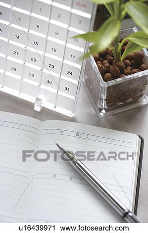 Stock Image - Stationary on desk. Fotosearch