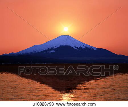 Stock Image - Sun above Mt. Fuji, Japan. Fotosearch