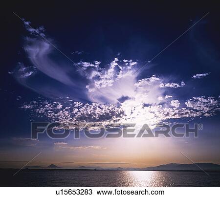 Sunbeams breaking through clouds View Large Photo Image Stock Image - Sunbeams breaking through clouds. Fotosearch