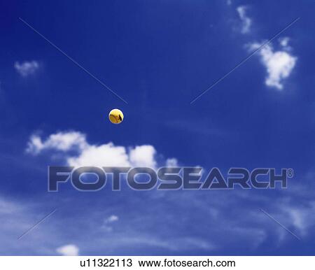 Tennis ball in the air View Large Photo Image Stock Image - Tennis ball in the air. Fotosearch