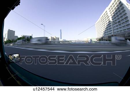 Picture - The view from car window, blurred motion, fish-eye lens, Tokyo prefecture, Japan. Fotosearch
