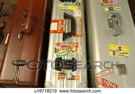 Stock Photo - Three suitcases, close up. Fotosearch