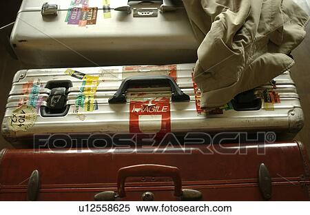 Three suitcases, close up View Large Photo Image Stock Photography - Three suitcases, close up. Fotosearch
