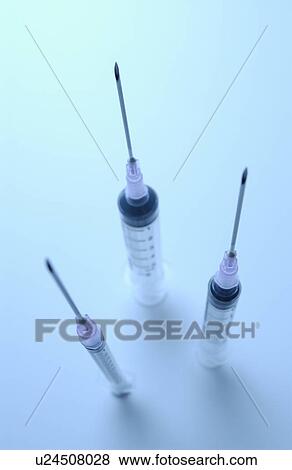 Three syringes with needles View Large Photo Image Stock Photo - Three syringes with needles. Fotosearch