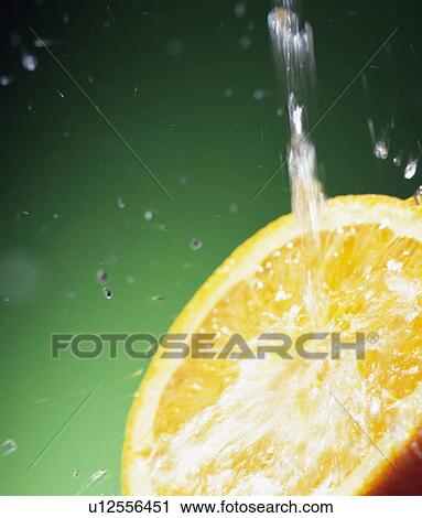 Water falling on orange View Large Photo Image Stock Image - Water falling on orange. Fotosearch