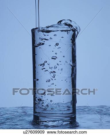 Water overflowing from glass View Large Photo Image Stock Photo - Water overflowing from glass. Fotosearch