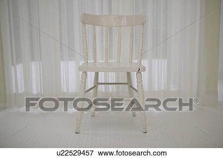 Stock Photo - White chair in white room. Fotosearch