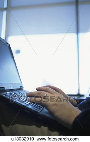 Stock Image - Woman using laptop. Fotosearch