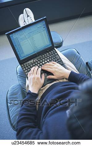 Stock Photography - Woman using laptop. Fotosearch