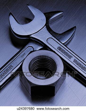 Stock Image - Wrenches and nut. Fotosearch