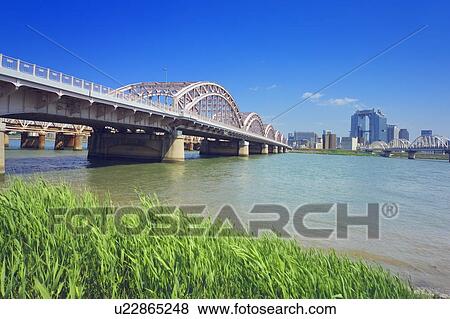 Stock Photo - Yodo river and skyline of Umeda, Osaka Prefecture, Honshu, Japan. Fotosearch