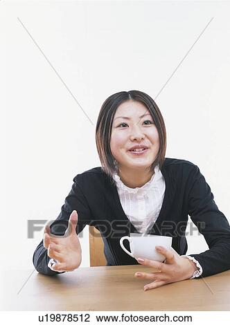 Young woman holding a coffee cup, smiling, white background View Large Photo Image Stock Image - Young woman holding a coffee cup, smiling, white background. Fotosearch