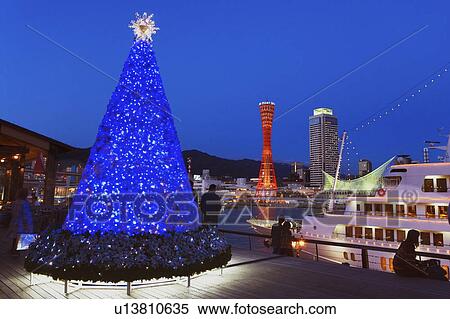 Stock Photography - A Christmas tree and the Kobe harbor in Kobe, Japan. Fotosearch
