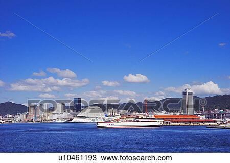 Stock Image - Ferry docks in Kobe harbor, Kobe, Hyogo Prefecture, Japan. Fotosearch
