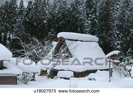 Stock Image - Hut covered in snow. Fotosearch