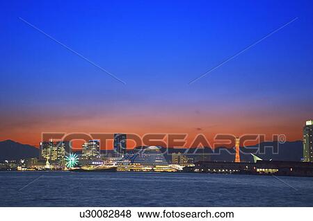 Stock Photo - Kobe harbour and city skyline in the evening, Kobe, Hyogo Prefecture, Japan. Fotosearch