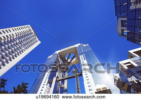 Stock Image - Low angle view of the Umeda Sky building, Kita-ku, Osaka, Japan. Fotosearch