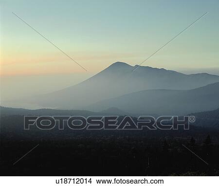 Picture - Mountain range shrouded in morning mist, Hachimantai, Iwate Prefecture, Japan. Fotosearch