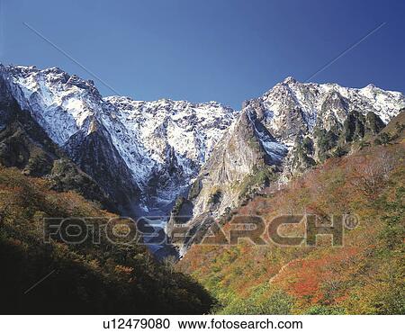Stock Image - Mt. Tanigawadake and autumn foliage, Gumma Prefecture, Japan. Fotosearch