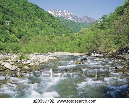 Stock Image - Mt. Tanigawadake and the Yubiso river, Gumma prefecture, Japan. Fotosearch