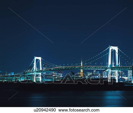 Stock Image - Rainbow Bridge at night, Minato-ku, Tokyo, Japan. Fotosearch