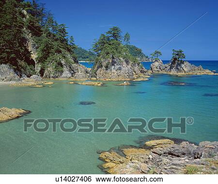 Stock Photograph - Rock formations by the sea, Uradome-kaigan, Iwami-machi, Tottori Prefecture, Japan. Fotosearch