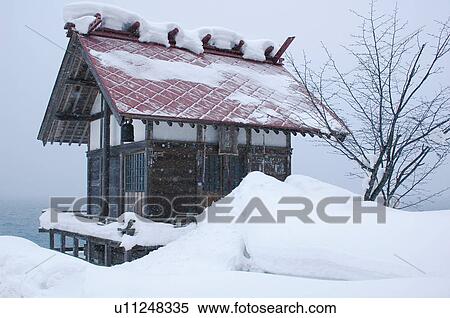 Stock Photography - Snow covered hut in Tazawako, Senboku, Akita Prefecture, Japan. Fotosearch