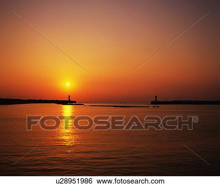 Stock Photograph - Sunset over the harbor, Misaki, Miura Peninsula, Kanagawa Prefecture, Japan. Fotosearch