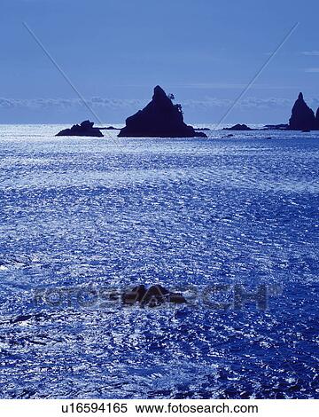 The ocean and silhouetted rock formations, Shizuoka Prefecture, Japan, View Large Photo Image Stock Photography - The ocean and silhouetted rock formations, Shizuoka Prefecture, Japan, . Fotosearch