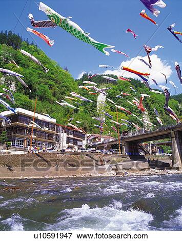 Tsuetate hot spring resort with carp streamers hanging overhead, Kumamoto Prefecture, Japan View Large Photo Image Stock Photo - Tsuetate hot spring resort with carp streamers hanging overhead, Kumamoto Prefecture, Japan. Fotosearch